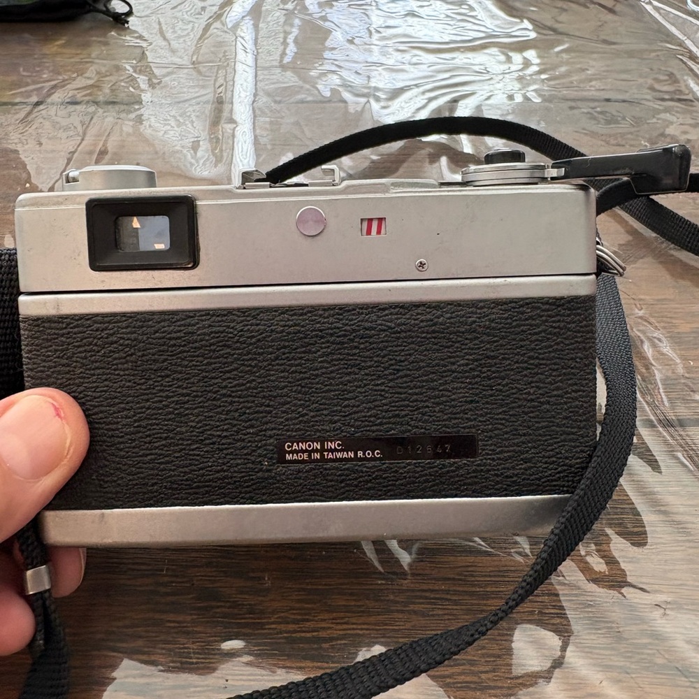 Canon Black and Silver Camera with Strap - Picture 3 of 4
